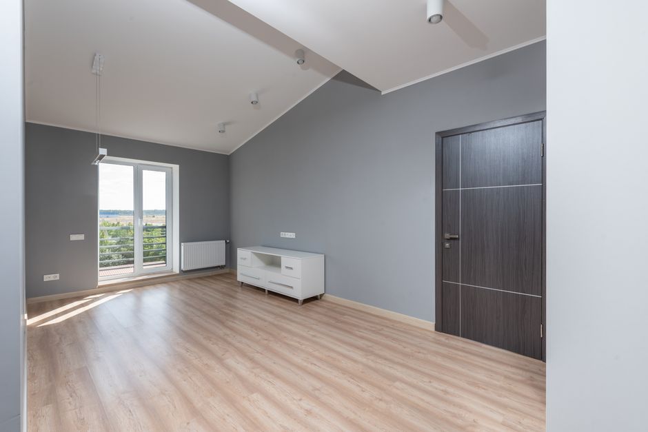 A bare, empty apartment with clean walls and floors and natural light, ready for a methodical move-in walkthrough inspection.