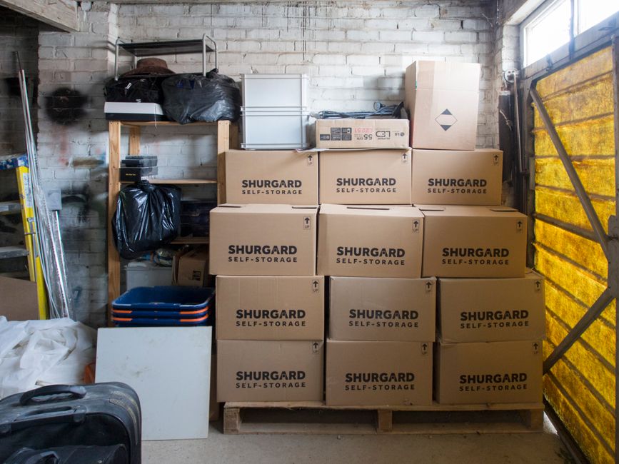 A home garage packed with storage boxes leaving no room to park a car