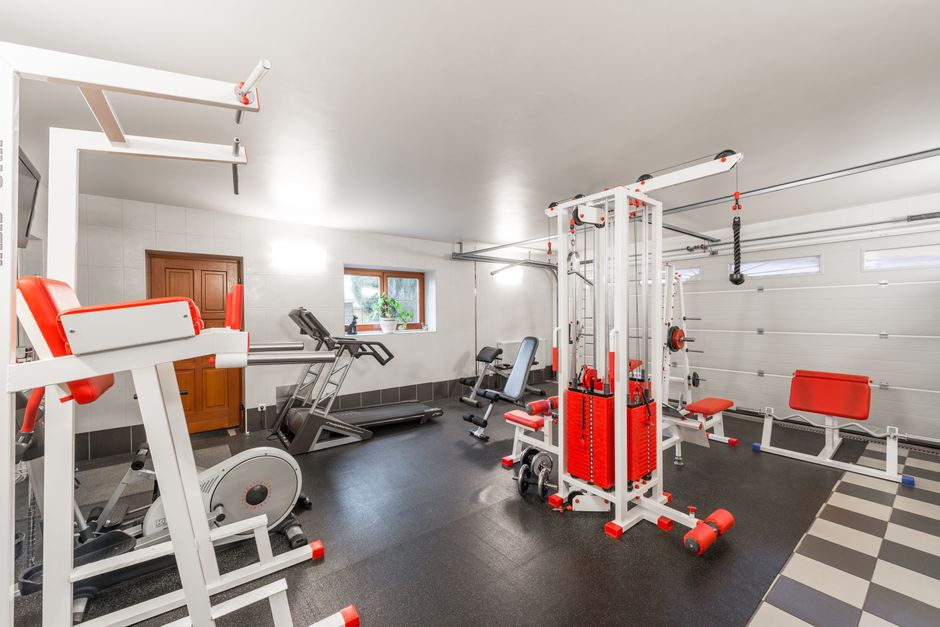 A treadmill set up in a home apartment, the type of exercise equipment whose vibration carries down to the unit below.