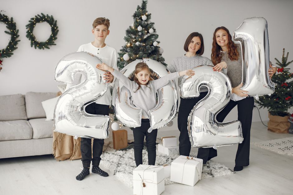 Inflatable holiday figures set up on a front lawn in a residential yard