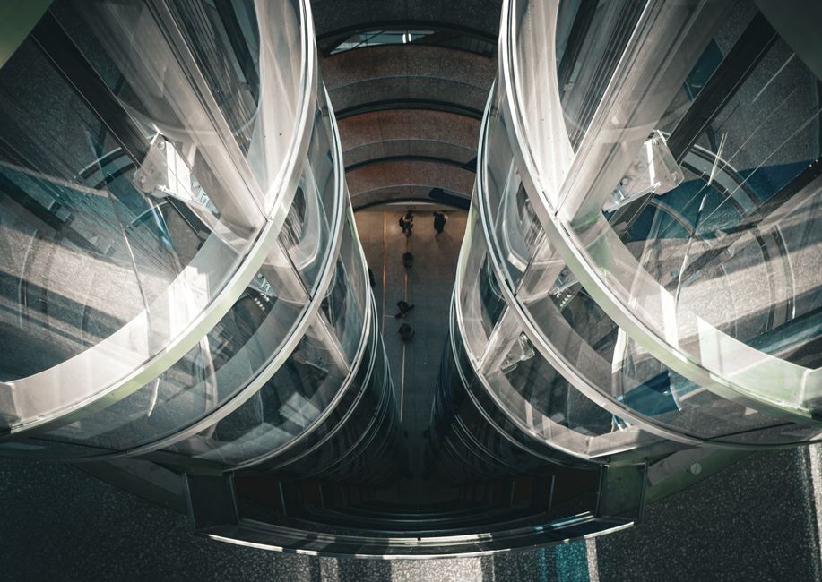 The interior of an apartment building elevator, one of the shared spaces where brief resident conversations and passing prese