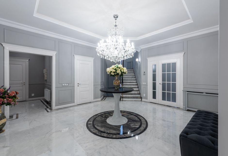 Warm LED ceiling lights illuminating an apartment building lobby at night