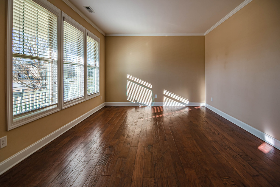 Window blinds with the cords secured out of a child's reach in an apartment