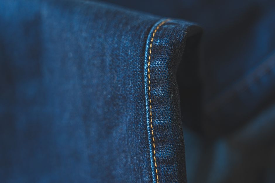 A close-up of a mattress seam and piping, one of the spots where bedbugs and their traces commonly hide.