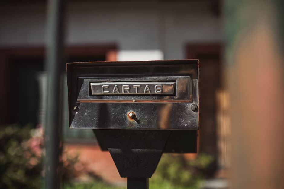 Letters overflowing from a residential mailbox