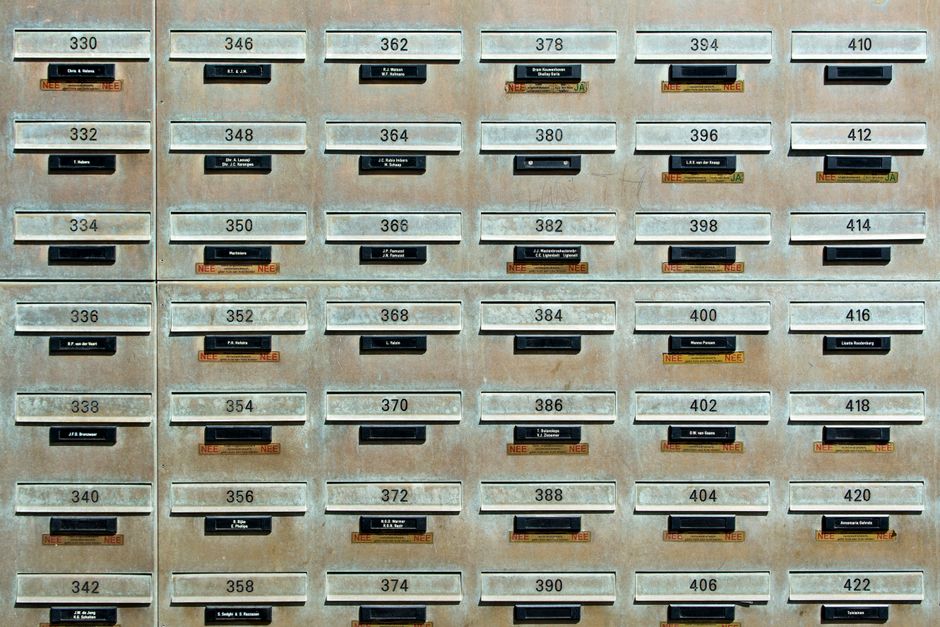 Electronic parcel lockers lining an apartment building lobby